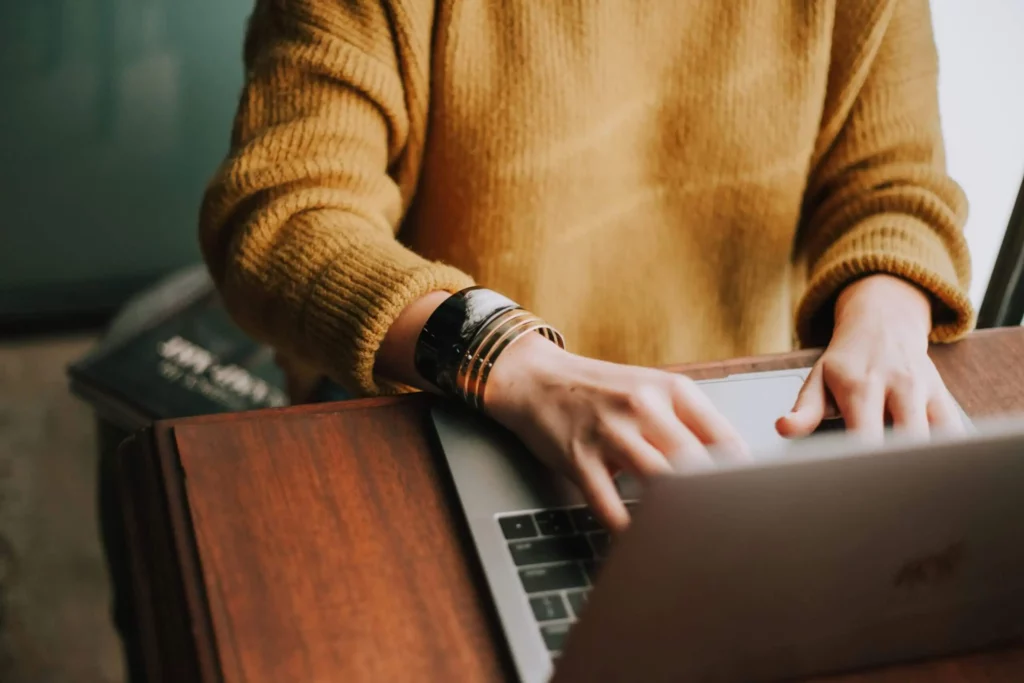 woman copywriting on her laptop at a table